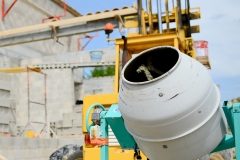 portrait of handsome construction worker on a building industry construction site