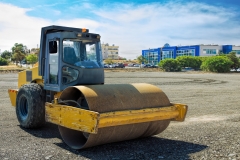 Roller compactor machine flattens the asphalt